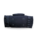Black duffel bag with side zippers and textured patches, ideal for travel or gym use.