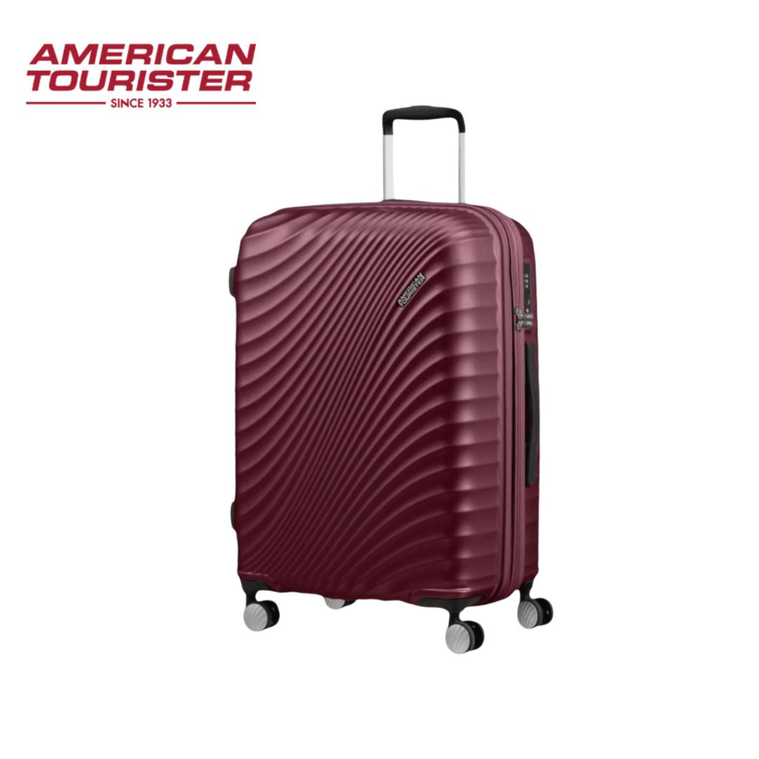Burgundy American Tourister hard shell suitcase with 4 spinner wheels and telescopic handle