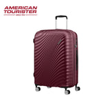 Burgundy American Tourister hard shell suitcase with 4 spinner wheels and telescopic handle