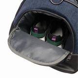 Blue travel backpack with separate shoe compartment holding sneakers, ideal for students and travelers