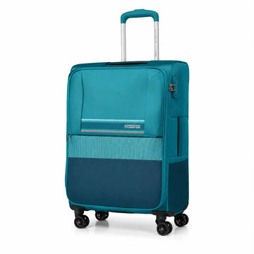 A teal and navy blue American Tourister spinner suitcase with an extended telescopic handle, shown on a clean white background.